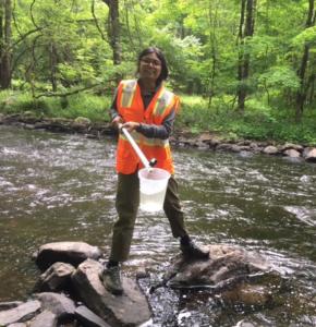 Undergrad researcher Raisa Islam collecting water samples in Connecticut.